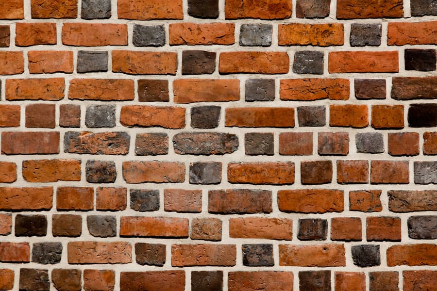 Close-up texture of high quality brick masonry showing crisp mortar joints